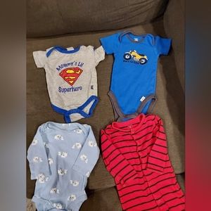 Lot of 4 Carters & Superman onesies/sleeper. Size 0-3 and 3-6 months